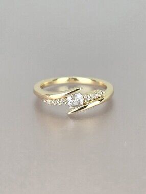Gold Solitaire Accent Ring with Pavé Stones